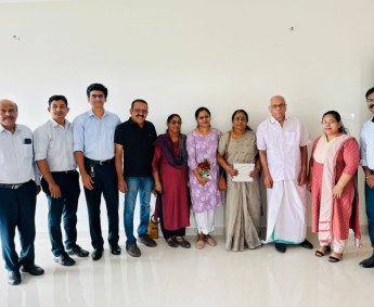 Our team with Ms.Sandhya Lakshmi and family of apartment No. B 12 in Triton Crescent ,after handing over.