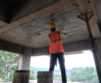 Shows 2nd floor ceiling plastering work has commenced.