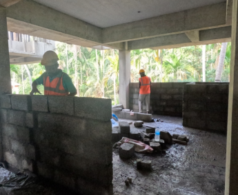 Shows 2nd floor masonry work in progress.