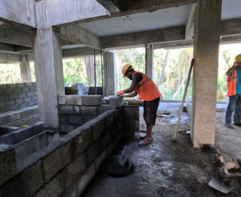 Another view of masonry work in progress on 3rd floor .